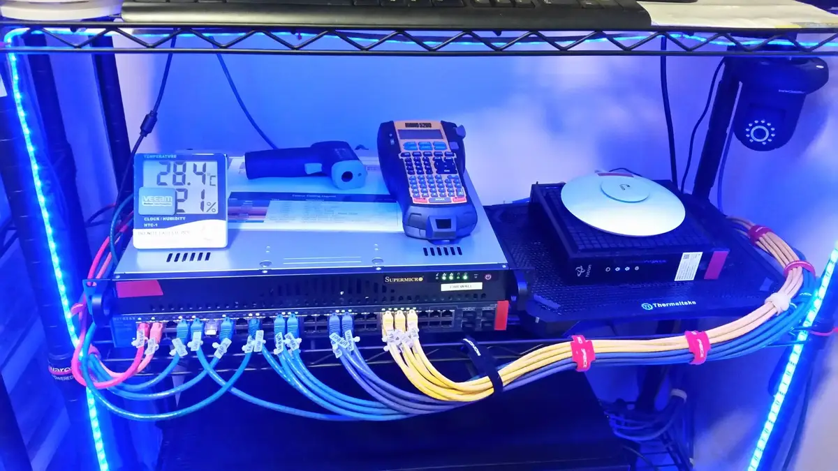 Network shelf with the Supermicro firewall, Netgear switch, wireless access point and modem