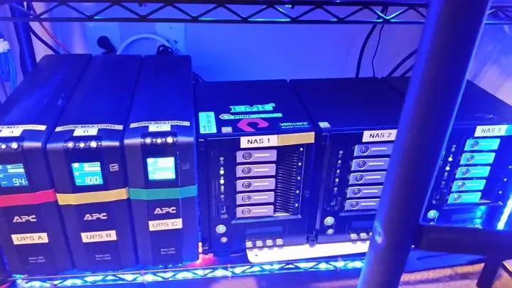 Close-up of the storage shelf and three UPS batteries