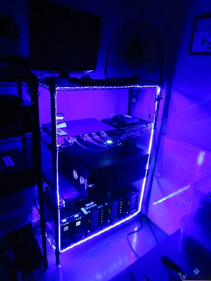 Home lab rack outlined by blue LED strips